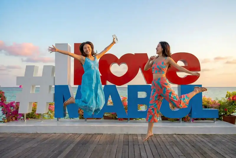 Famous photo spot at the I Love Mabul sign on Mabul Island Sea Plus Water Chalet Resort