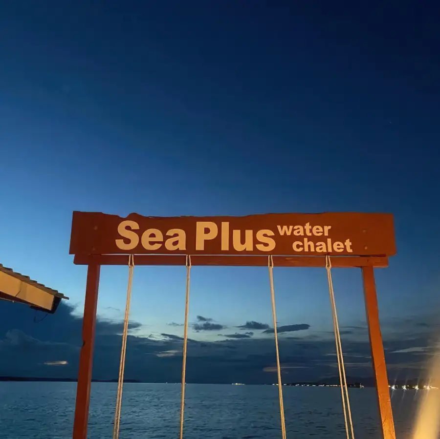Welcome sign and reception area at the overwater resort Sea Plus Water Chalet Resort