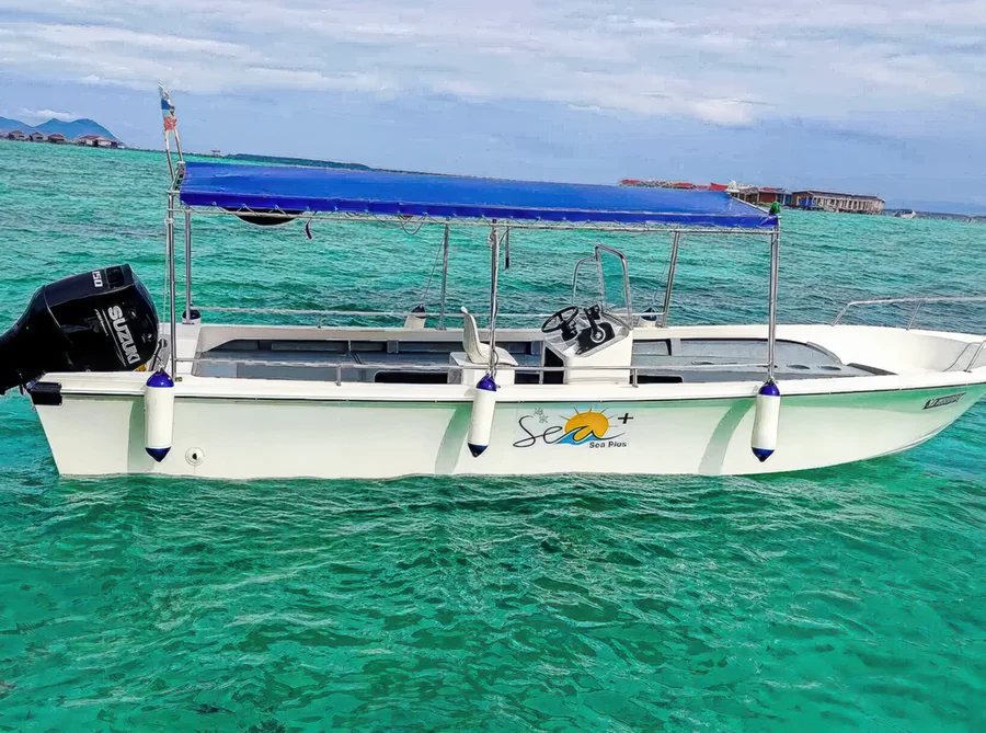 Aerial drone view of a speedboat at the overwater resort Sea Plus Water Chalet Resort