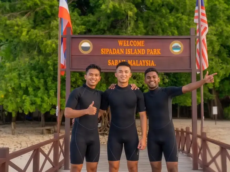 Group of scuba divers exploring Sipadan Island Sea Plus Water Chalet Resort