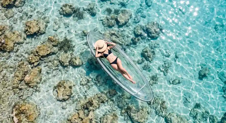 Recreational kayaking activity in the calm turquoise sea Sea Plus Water Chalet Resort