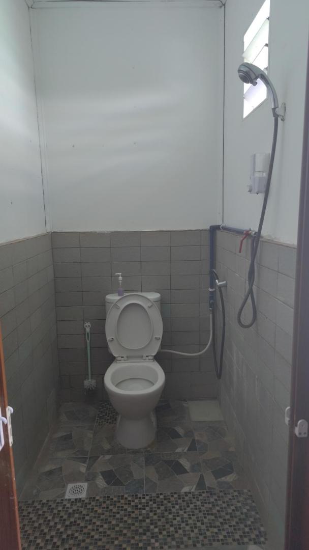 A practical simple bathroom at Sea Plus Water Chalet Resort, an over the water resort near Semporna.