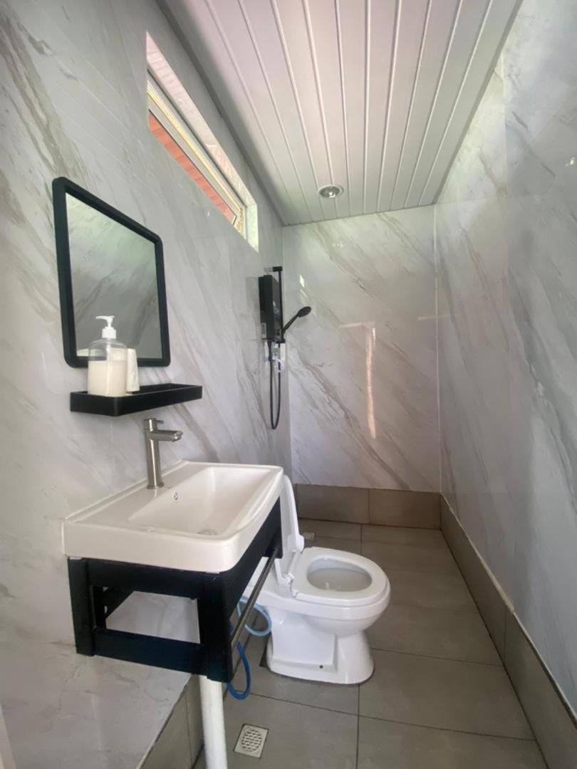 A simple and clean bathroom at Sea Plus Water Chalet Resort, a floating resort near Semporna.